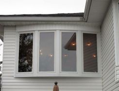 White-Bow-Casement-windows-on-vinyl-siding